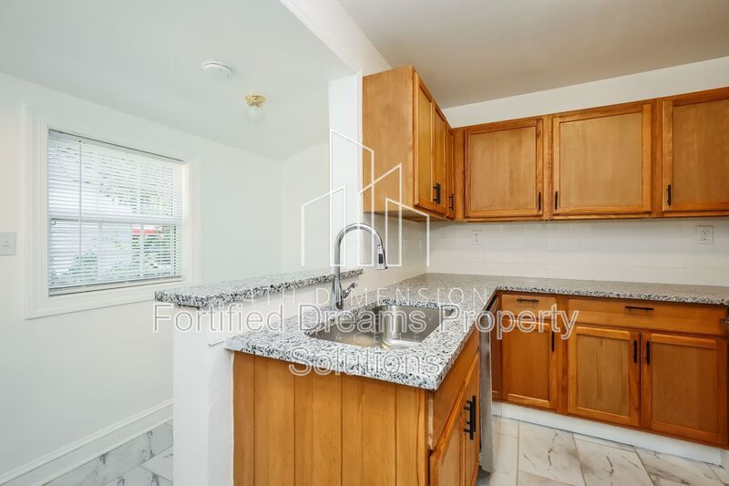 Charming 3-Bed Home - Cozy 936 Sq Ft - Covered Parking & Large Storage Shed property image