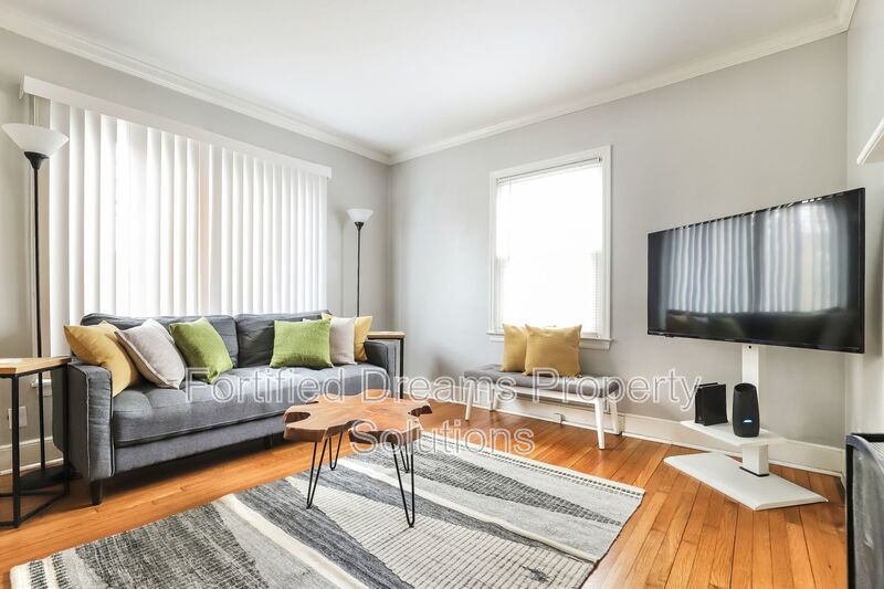 Charming Furnished 2-Bedroom Cottage with Fenced Yard in 27408! property image