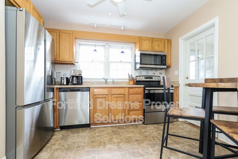 Charming Furnished 2-Bedroom Cottage with Fenced Yard in 27408! property image