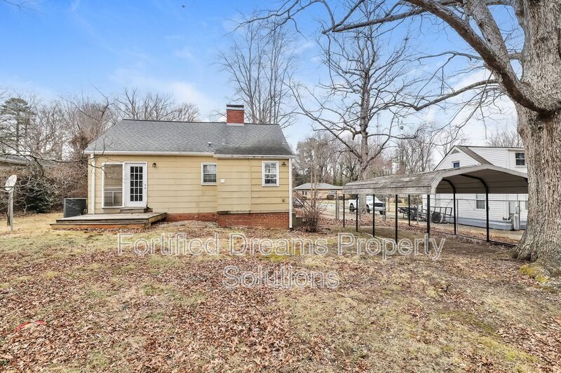 Charming Furnished 2-Bedroom Cottage with Fenced Yard in 27408! property image