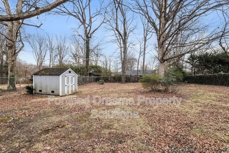 Charming Furnished 2-Bedroom Cottage with Fenced Yard in 27408! property image